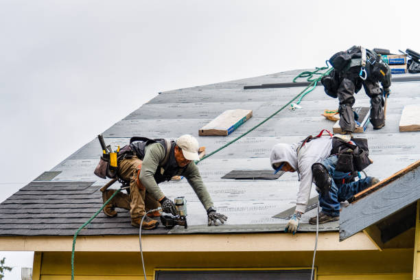 Professional Roof Replacement technician working in Brentwood, NY
